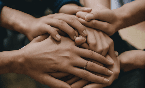 Hands coming together in collaboration