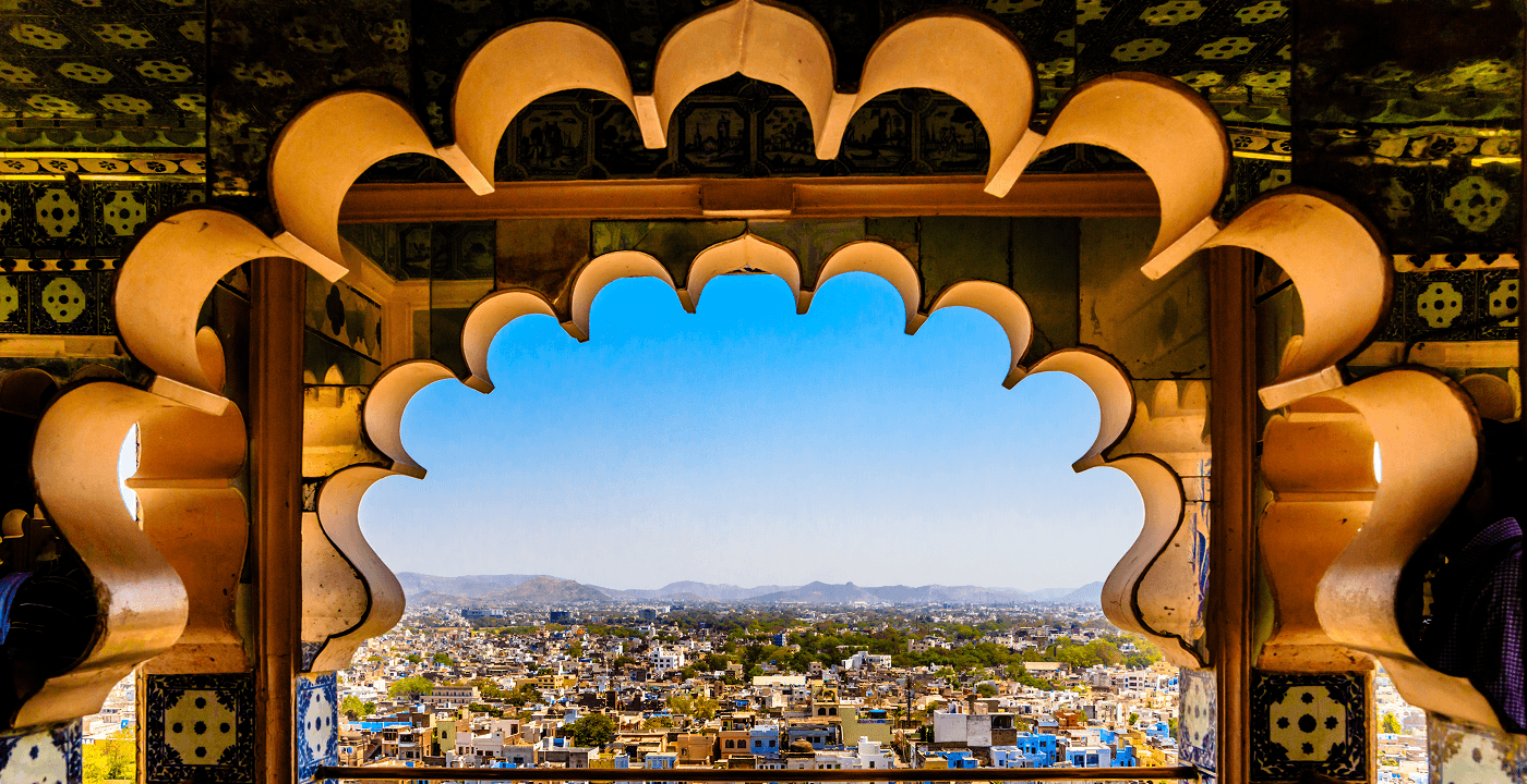 View of Indian city through ornate Mughal archway