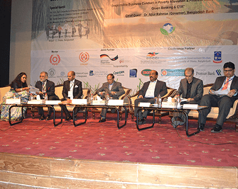 Conference panel discussion with multiple speakers seated at a table